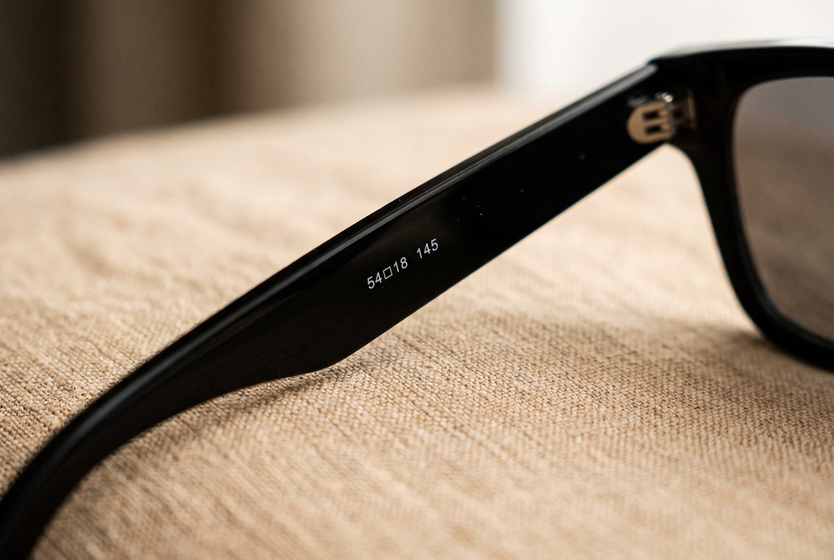 Size numbers 54□18 145 printed inside a sunglasses arm