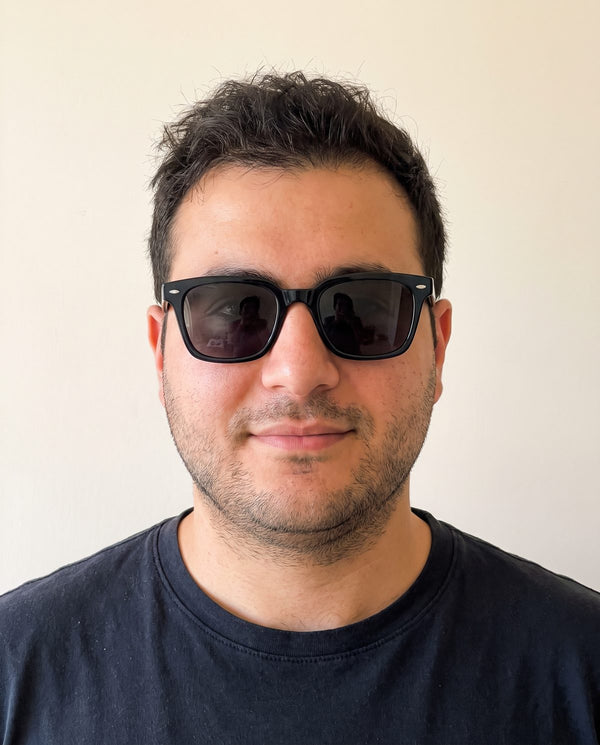Round face wearing square sunglasses