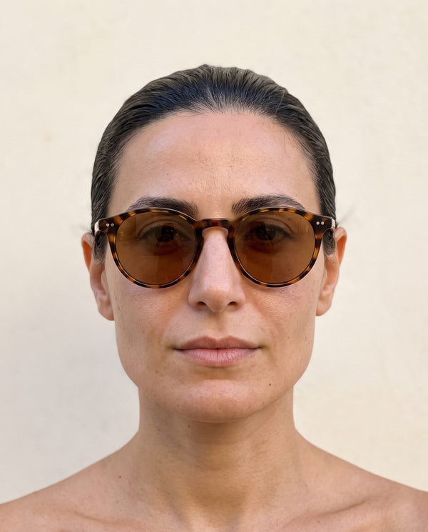 Square face wearing round sunglasses